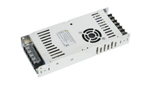 Metal enclosed DC switching power supply module with cooling vents and terminal blocks on both ends.