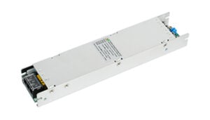 Slim silver metal DC power supply module with terminal block at the end edge, shown at an angle.