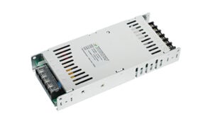 Metal switching power supply module with vent slots and a front-terminal block for connections