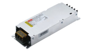 Metallic DC/AC power supply module with a yellow terminal block at the front and safety label on top
